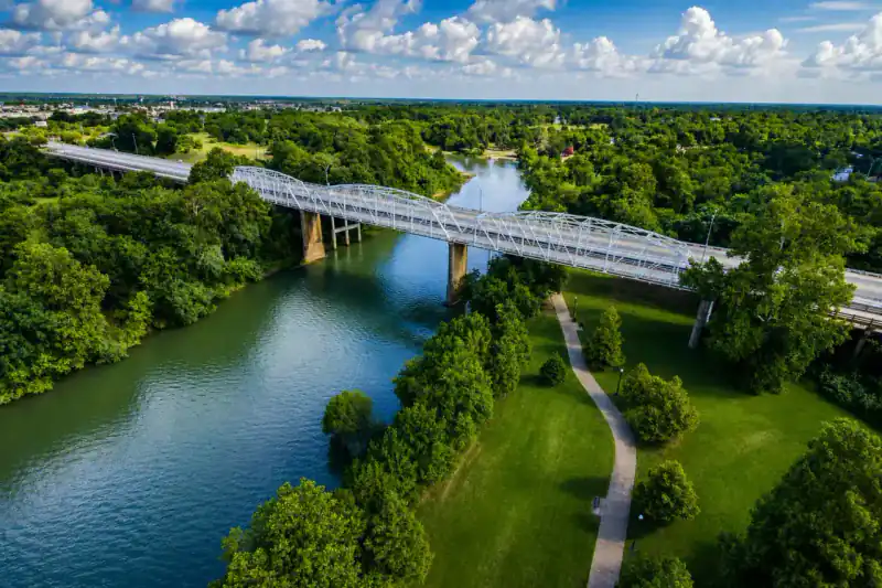 Aerial view of a bridge over the Colorado River in Bastrop, Texas
